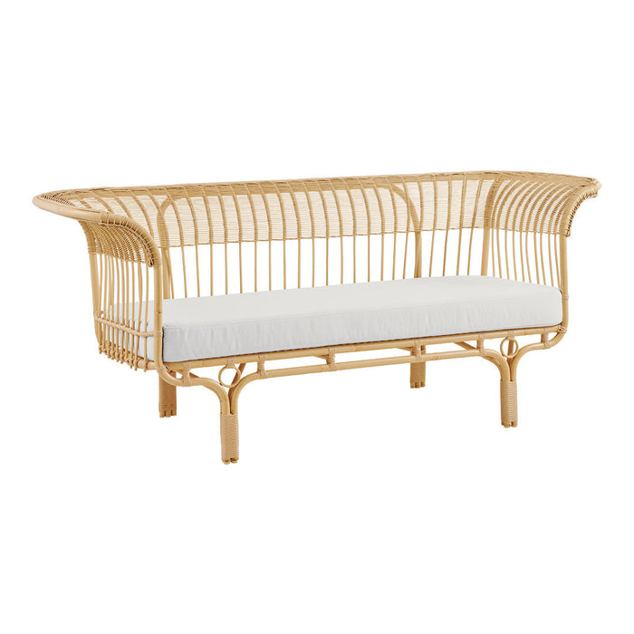 Natural rattan sofa with a sleek open weave design and a crisp white cushion for a fresh, modern look.