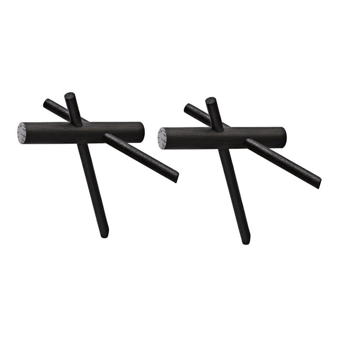 Two geometric black metal sculptures with unique linear patterns and minimalist design accents.
