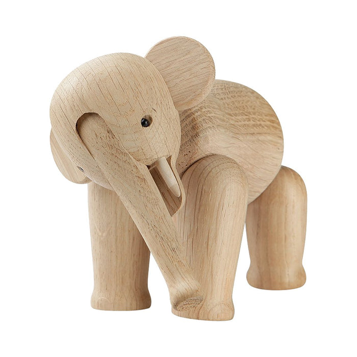 Natural wood elephant figurine in light beige tones with smooth, minimalist design. Perfect for decor and gifting.