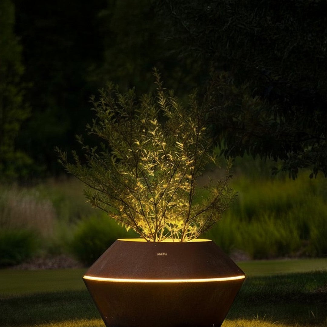 Elegant brown geometric planter with soft glowing light, featuring green foliage against a rich backdrop of nature.