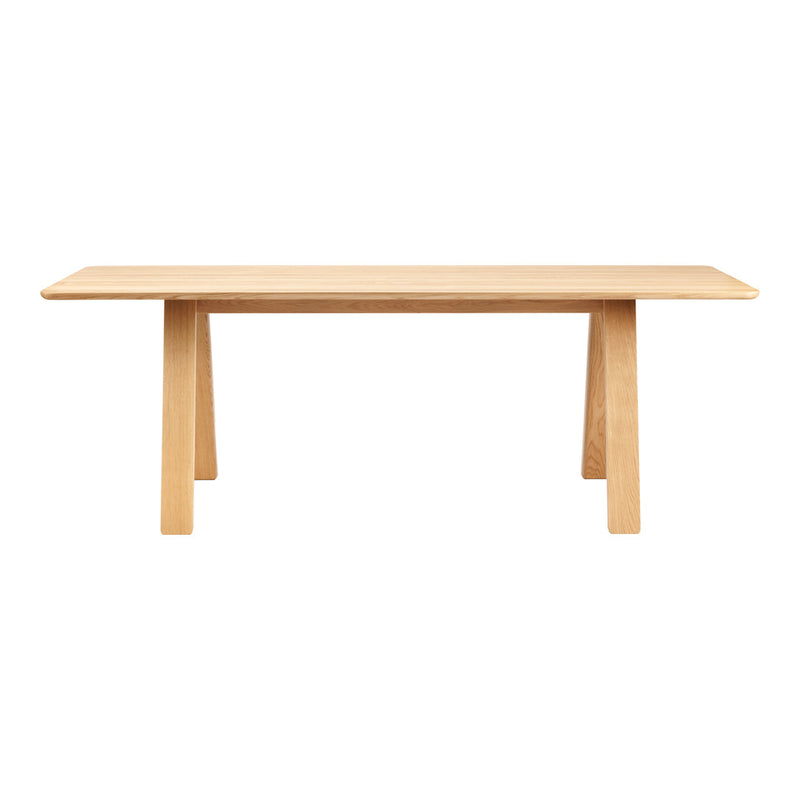 Light natural wood dining table with a smooth finish and minimalist design, featuring clean lines and no visible patterns.