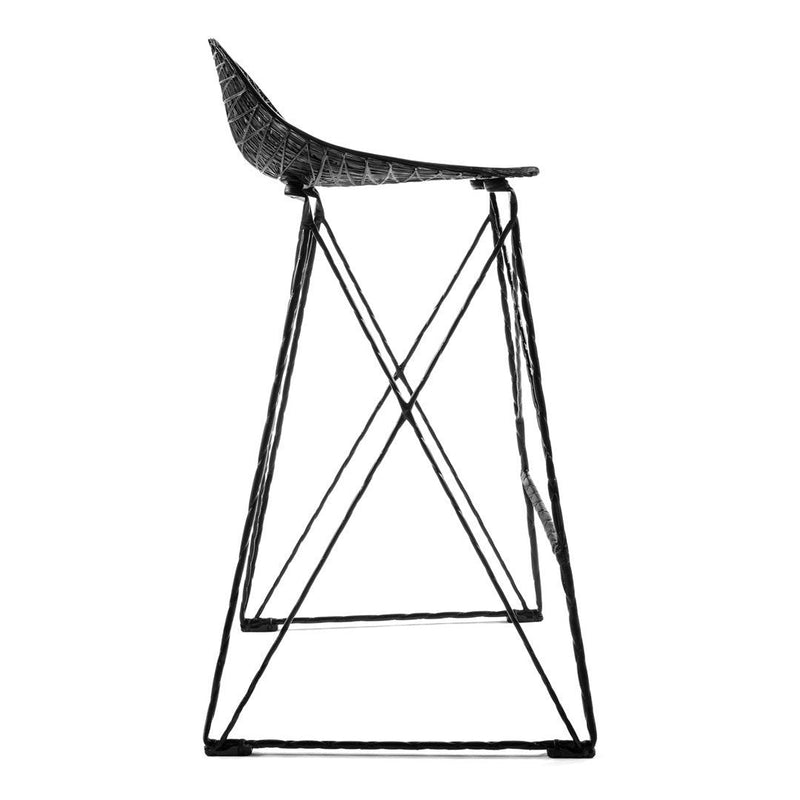 Black and white bar stool featuring a textured seat and sleek geometric metal frame. Modern and minimalist design.