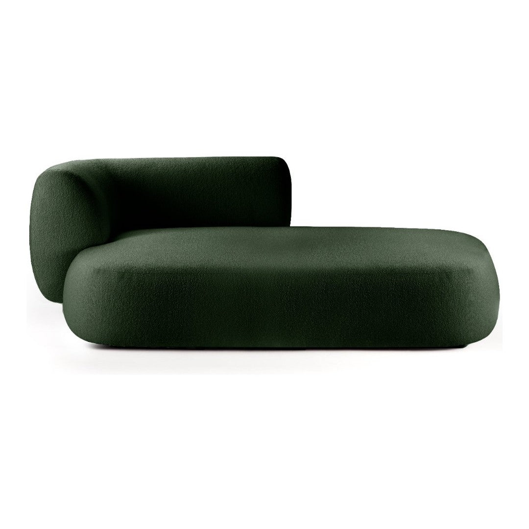 "Modern dark green curved sofa with a smooth, textured finish and minimalist design."