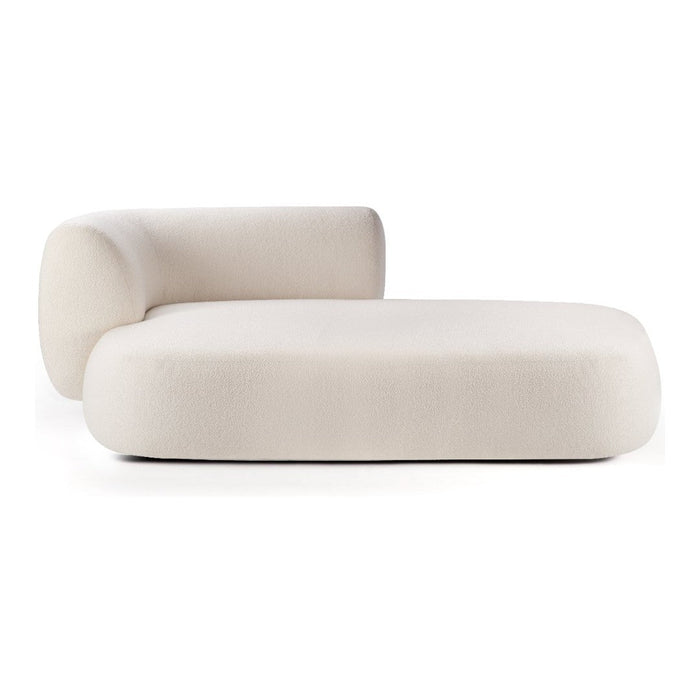 Cream curved chaise lounge with smooth minimalist design and no visible patterns, offering a modern aesthetic.
