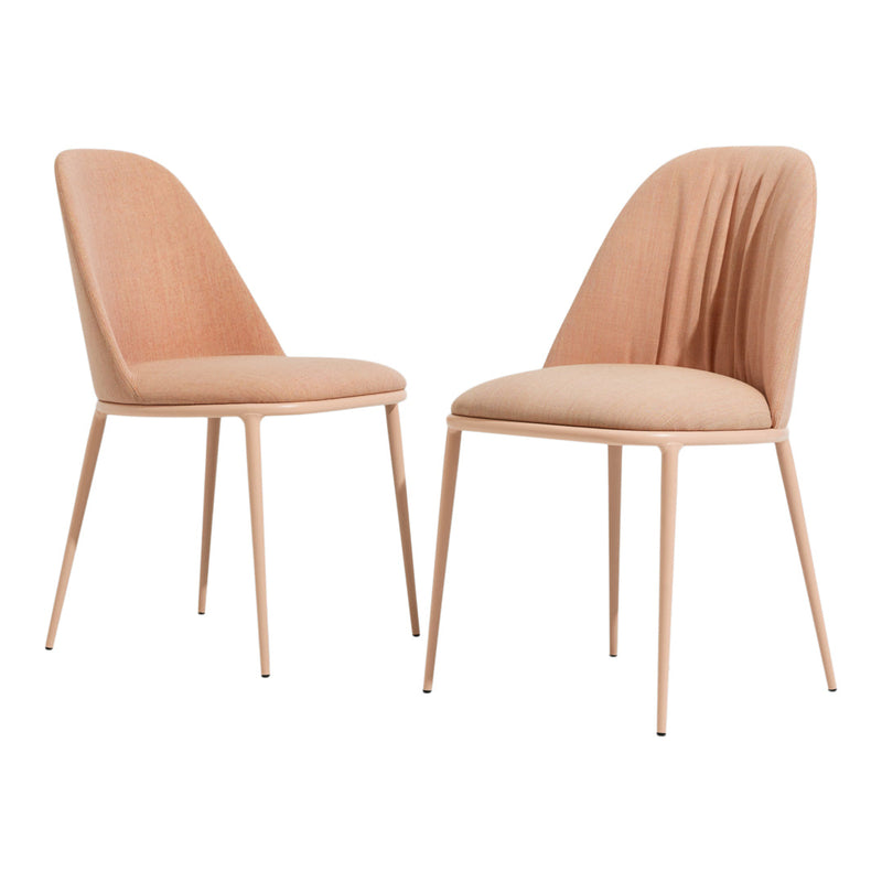 "Two modern chairs in soft peach upholstery with sleek legs, featuring a subtle textured pattern."
