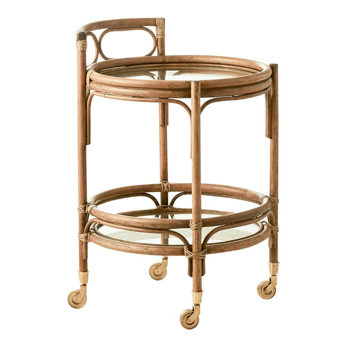 Rattan serving cart in natural wood tones with sleek, minimalist circular design and clear glass shelves.
