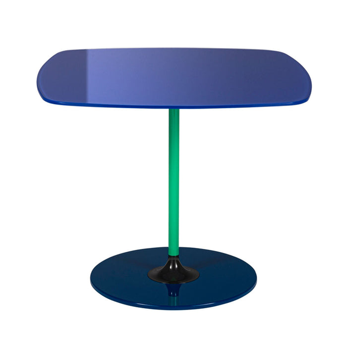 Modern table featuring a glossy blue top, green pole, and black base for a striking color combination.
