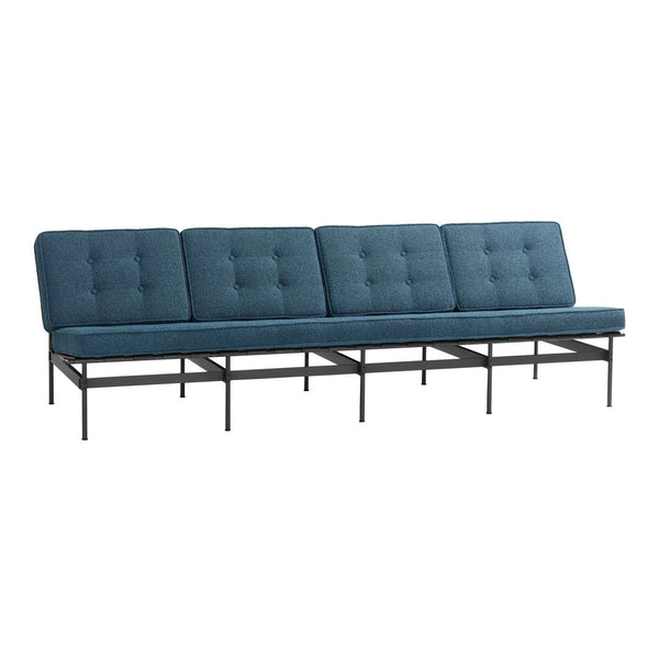 Modern teal sofa with tufted cushions and a sleek black metal frame, offering a stylish contemporary design.