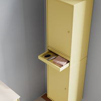 Tall yellow cabinet with a sleek design, featuring a minimalist pattern and a subtle drawer detail.