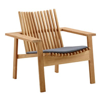 Light wood chair with vertical slat design and a gray cushion, showcasing a modern, minimalist aesthetic.