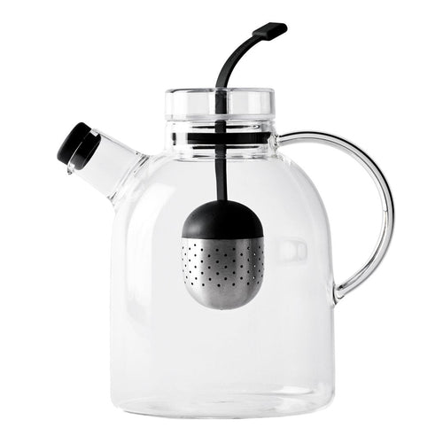 Clear glass teapot with a black tea infuser, featuring smooth, modern lines and a minimalist design.