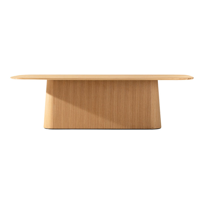 Light oak wood table with a sleek, minimal design and a smooth surface featuring subtle, natural grain patterns.
