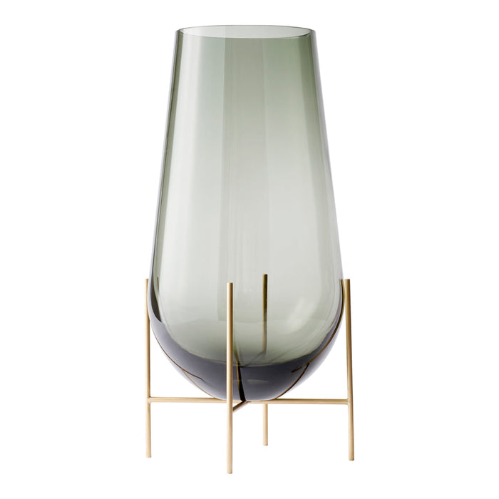 Green-tinted glass vase with a smooth gradient and chic gold metal stand, perfect for modern decor.