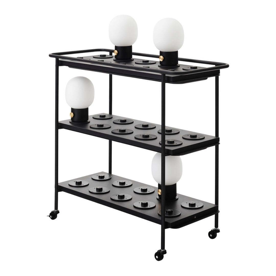 Black metal shelving unit with circular white lamp shades and a minimalist, modern design.