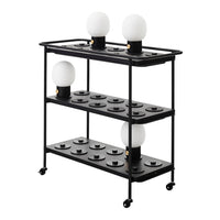 Black metal shelving unit with circular white lamp shades and a minimalist, modern design.
