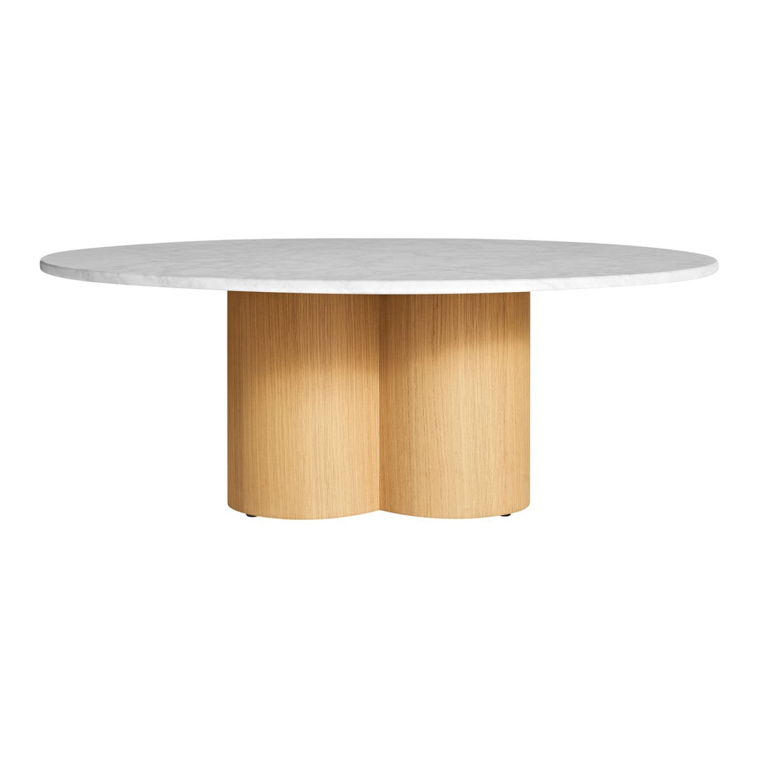 Round marble and light wood dining table with smooth surfaces and minimalist design. Elegant neutral color palette.