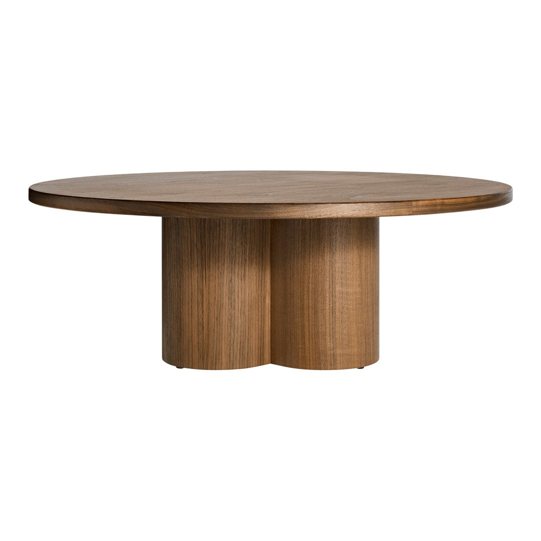 Round wooden table with a smooth, light brown finish and a minimalist design featuring curved, cylindrical legs.