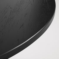 Black wood surface with subtle grain patterns and a smooth, rounded edge, ideal for modern decor.
