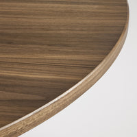 Brown wood grain table surface with subtle stripes and a smooth rounded edge.