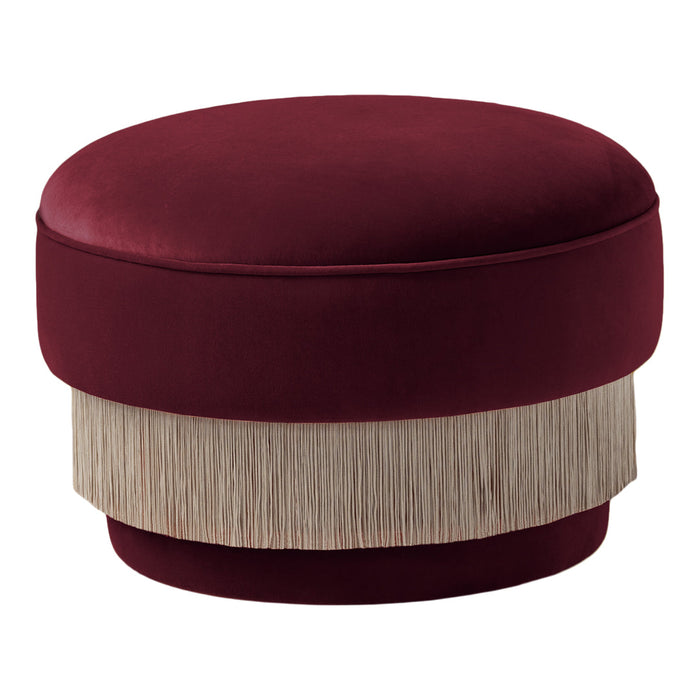 Burgundy velvet ottoman with a textured cream fringe, adding elegance and warmth to any space.