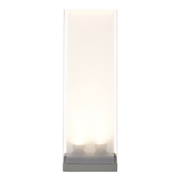 Modern tall lamp with a sleek transparent shade and gray base, featuring soft white light emitting glow.