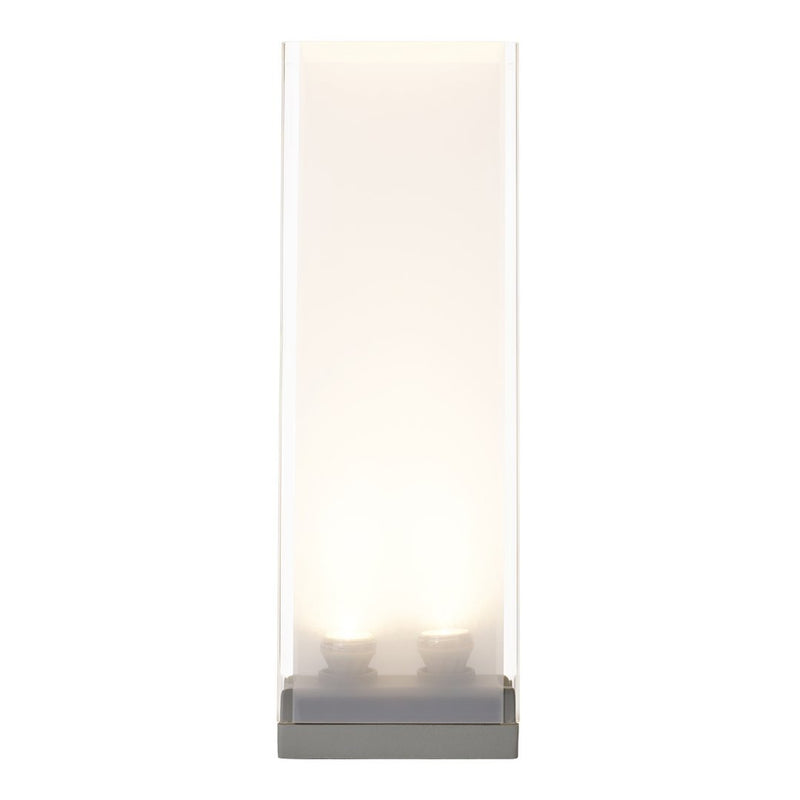 Modern tall lamp with a sleek transparent shade and gray base, featuring soft white light emitting glow.