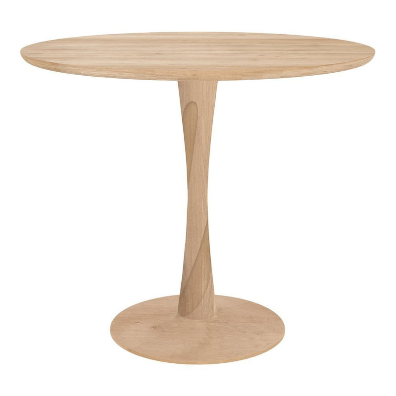 Light natural wood round table with a smooth surface and a stylish tapered base, showcasing warm beige tones and subtle patterns.