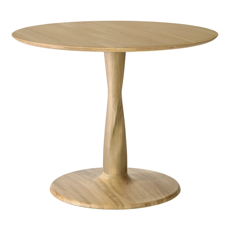 Natural wood round dining table with light oak finish and smooth, minimalistic design. Perfect for modern interiors.