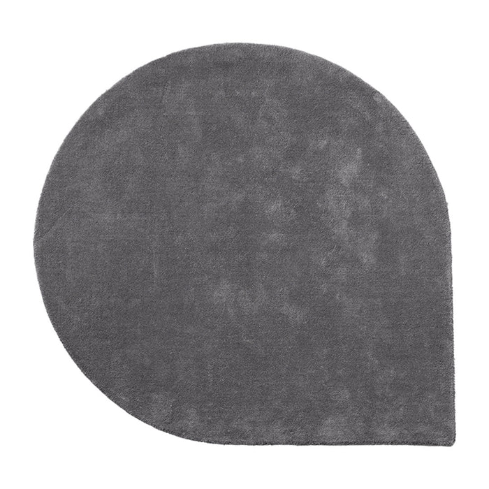 Gray round rug with a smooth texture and modern design, perfect for contemporary home decor.