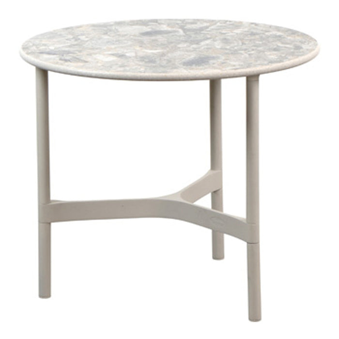 Round table with a gray and white marble-like top and light gray legs, featuring a smooth, contemporary design.