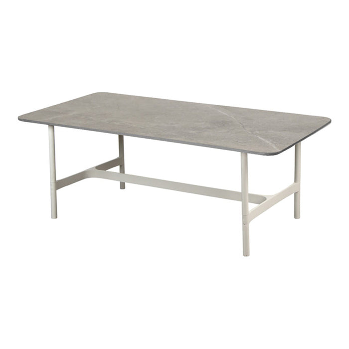 Gray rectangular tabletop with subtle marbling, set on a sleek white metal frame. Modern and minimalist design.