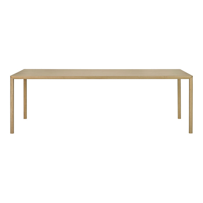 Minimalist rectangular table in a sleek gold finish with a smooth surface and clean lines. Perfect for modern decor.