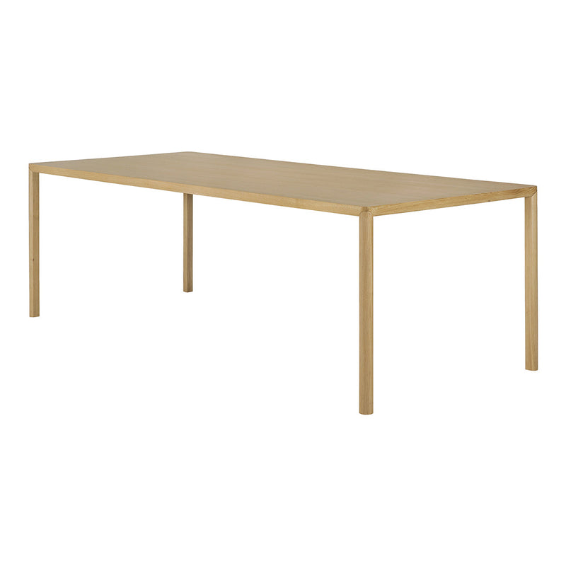 Sleek natural wood dining table in a light oak finish, featuring a minimalist design with clean lines.