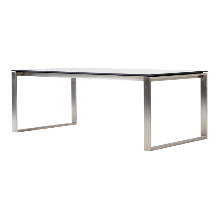 Sleek silver metal dining table with a smooth black top, perfect for modern interiors.
