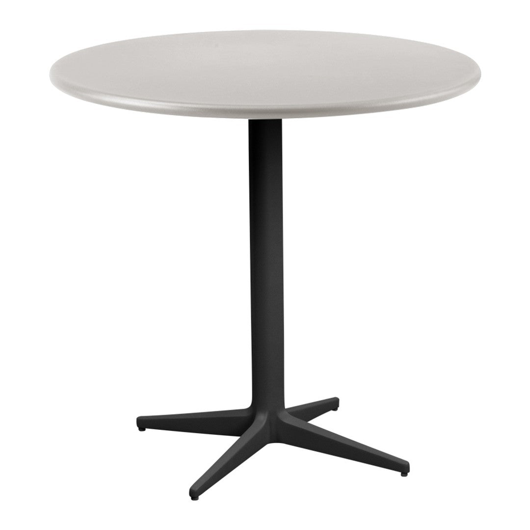 Round table featuring a sleek gray top with a minimalist black base, perfect for modern decor.