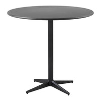 Round black dining table with a smooth surface and sleek four-legged base, perfect for modern decor.
