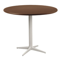 Round table with a rich brown wood top and a sleek white metal base, showcasing a modern, minimalist design.