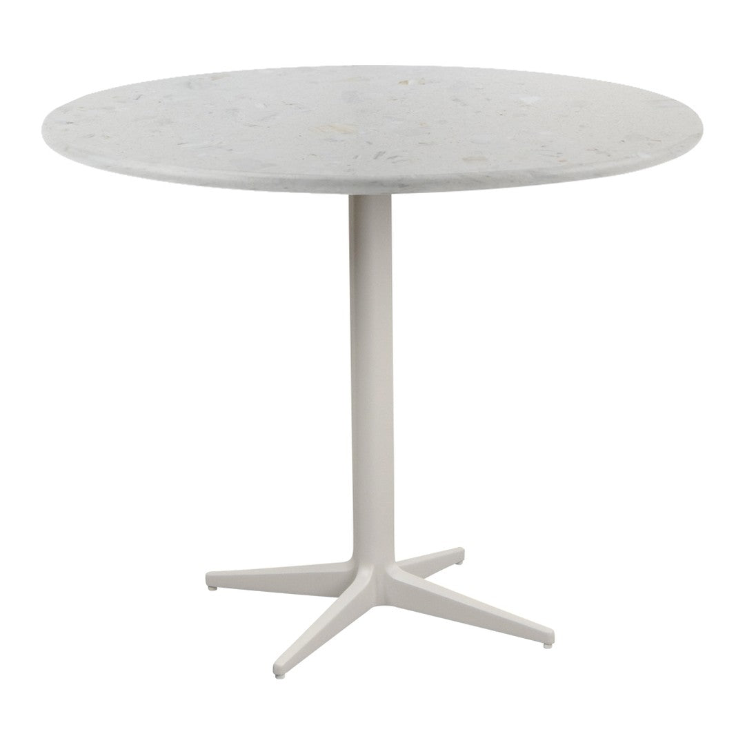 Round white marble table with a smooth surface and minimalist white base, perfect for modern decor.