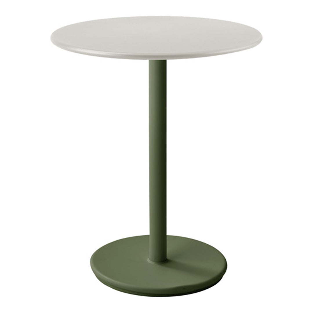 Round table with a white top and a green base, featuring a minimalist design and smooth surfaces.