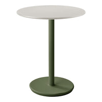 Round table with a white top and a green base, featuring a minimalist design and smooth surfaces.