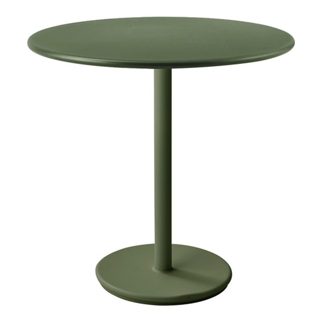 Round green table with a solid smooth finish and a minimalist design, perfect for modern decor.