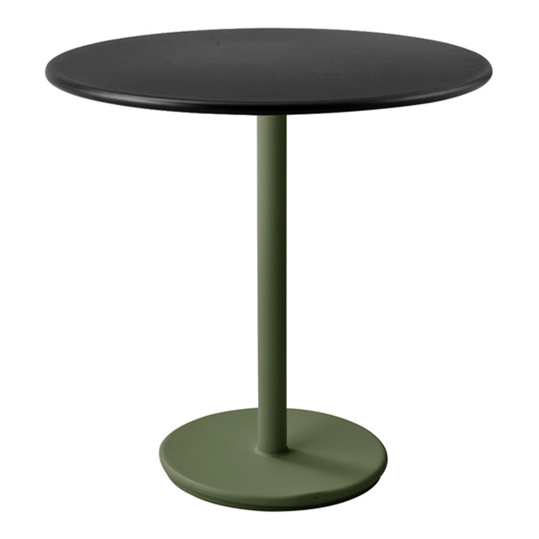 Round table with a sleek black top and matte green base, featuring a minimalist design. Perfect for modern decor.