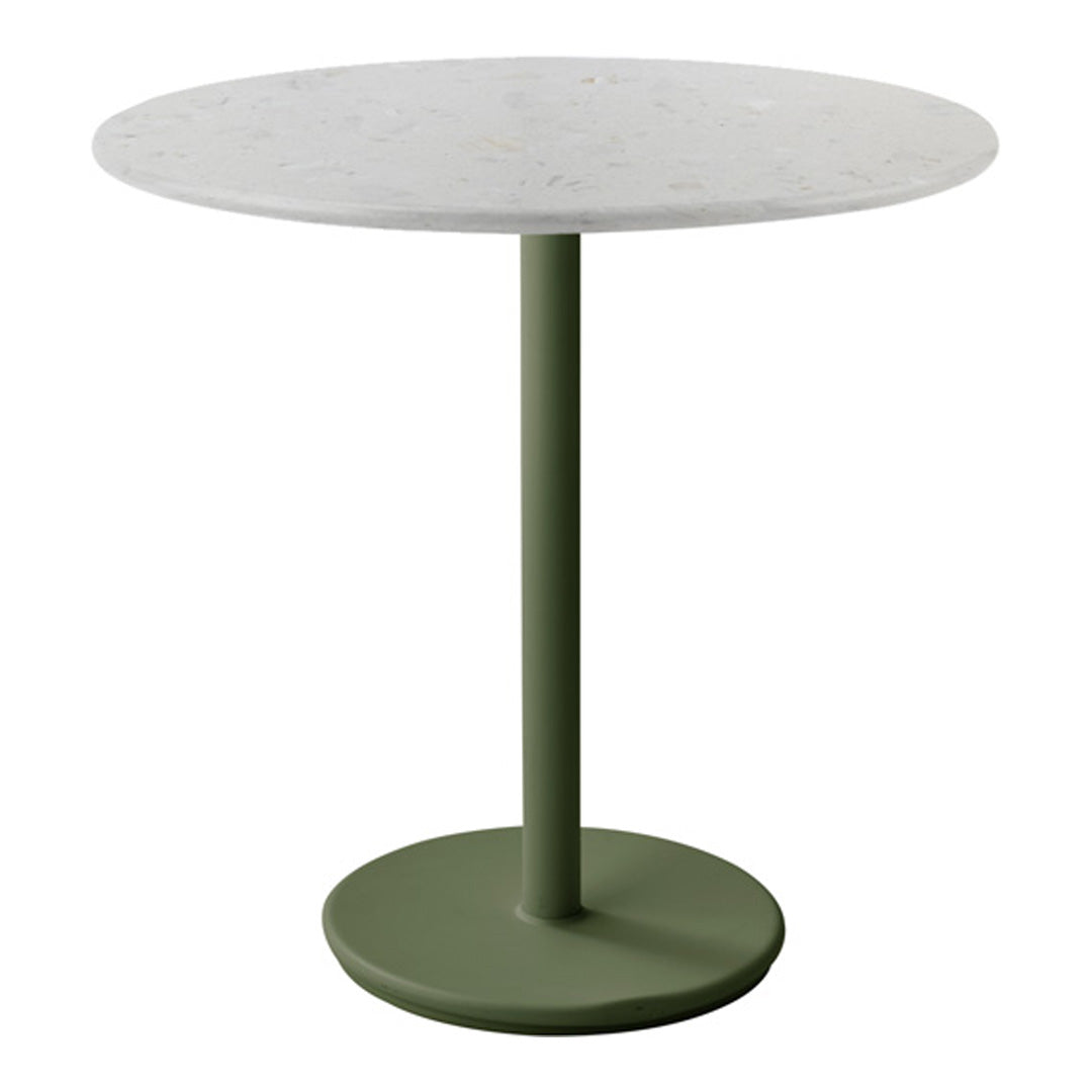 Round table with a white speckled tabletop and an olive green base, featuring a sleek, minimalist design.