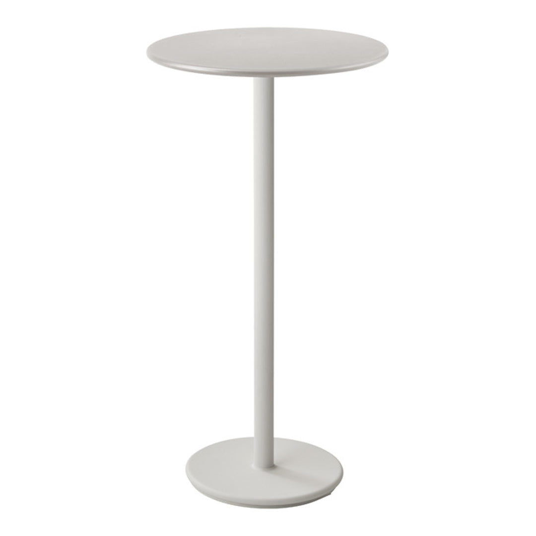Minimalist round side table in soft white, featuring a sleek, smooth finish and a simple, modern design.