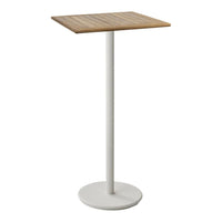 Minimalist table with a square wood top and a sleek white metal base, combining natural and modern design elements.