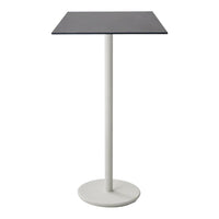 Stylish black tabletop with a sleek white pedestal base, perfect for modern spaces.
