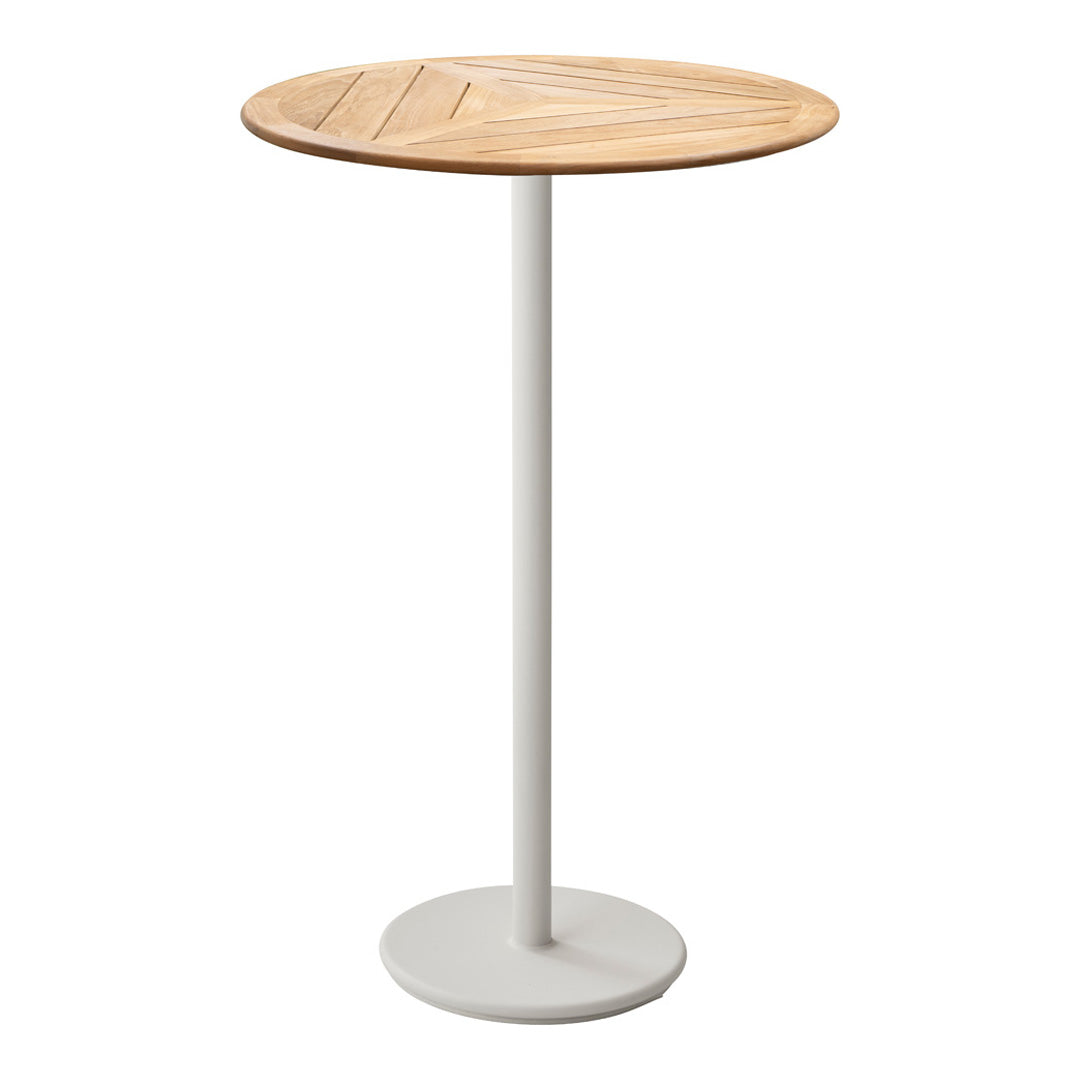 Round wooden table with a light oak finish and textured pattern, paired with a white metal base. Ideal for modern decor.