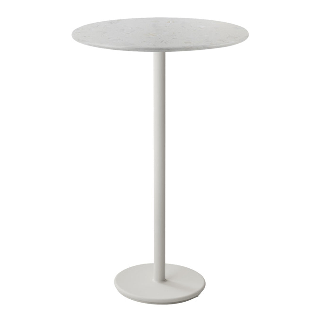 Round white table with a smooth surface and sleek, minimalistic design featuring a solid white base.