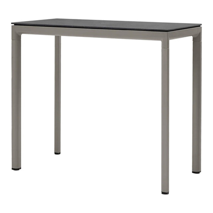 Gray metal table with a sleek black top, perfect for modern decor. Clean lines and minimalist design.