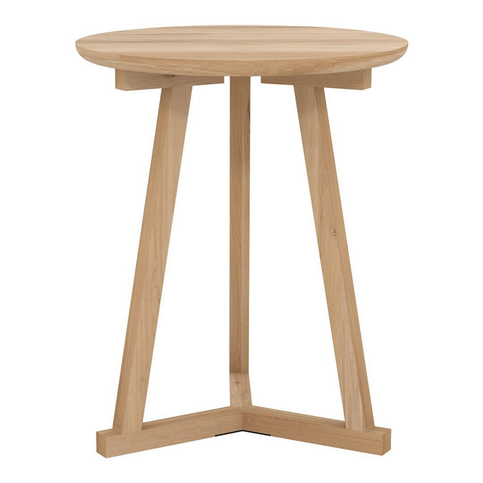 Light natural wood side table with a smooth round top and minimalist angular legs, showcasing a modern, neutral aesthetic.
